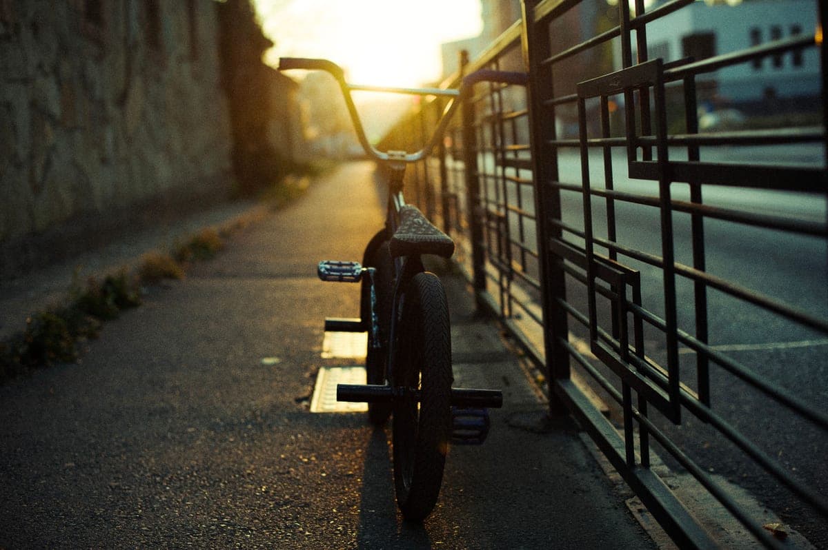 A bicycle on an urban street at dusk