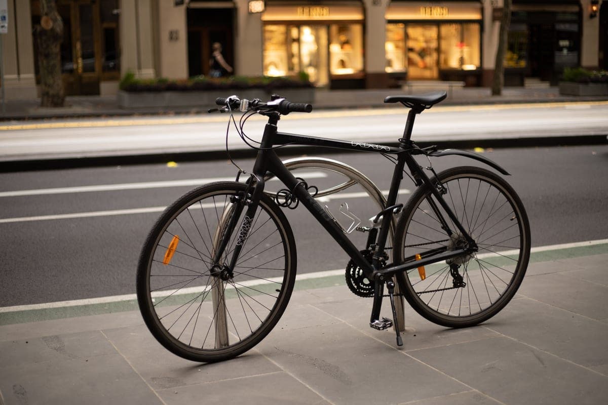 A bicycle parked on a city sidewalk